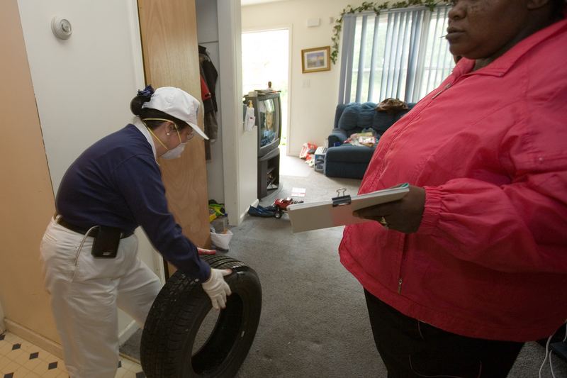 Volunteer helping a resident after flood damage in New Jersey